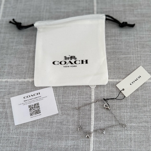 Coach Jewelry - Coach charm silver bracelet with dust bag